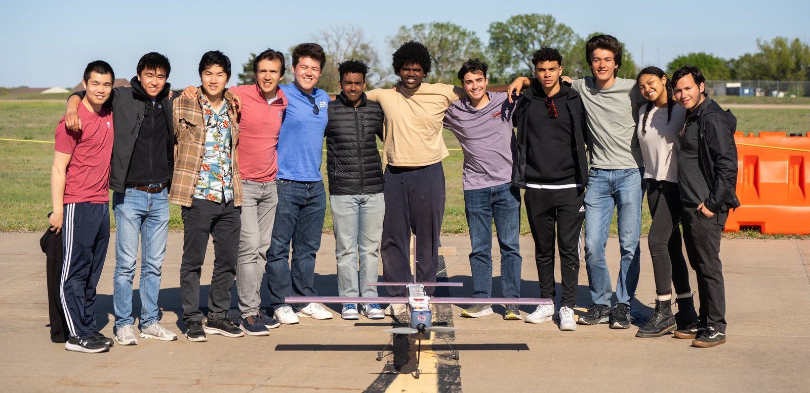 Stanford DBF members standing with their competition aircraft