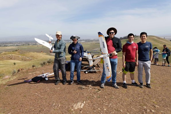 Stanford students gathered outdoors with RC airplanes